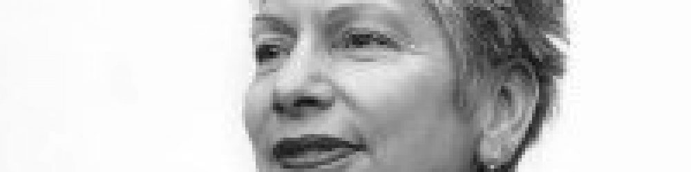 A black and white photo of a woman 's face.